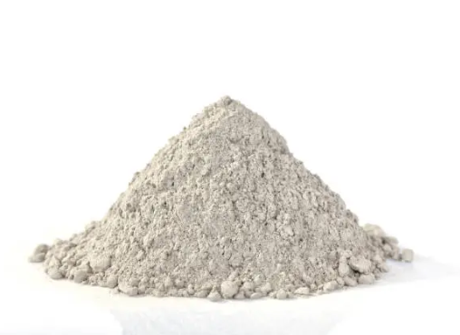 Pile of gray cement kiln dust powder on a white background