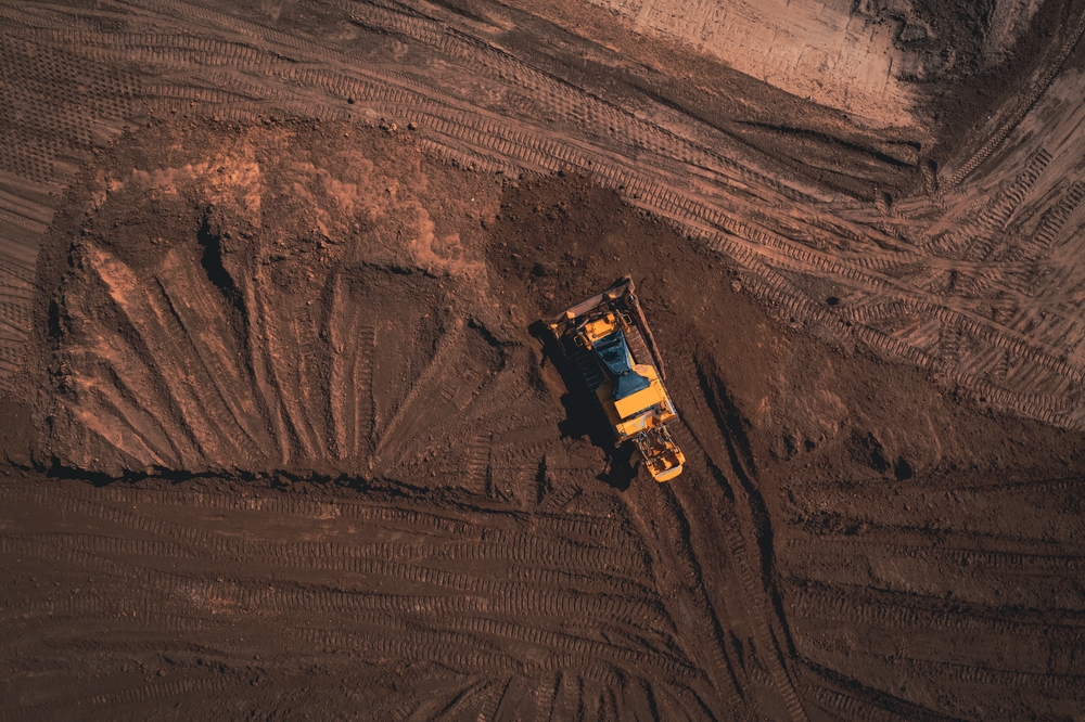 Aerial view of soil stabilization equipment working on a Permian Basin construction site