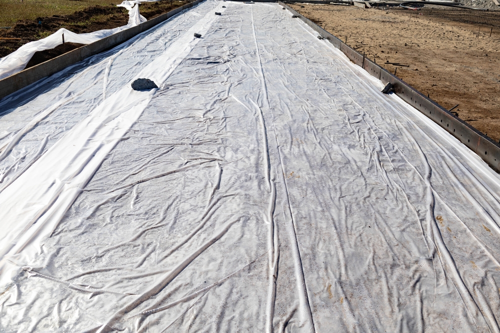 Geotextile fabric covering fly ash stabilized subgrade on a Texas road construction site